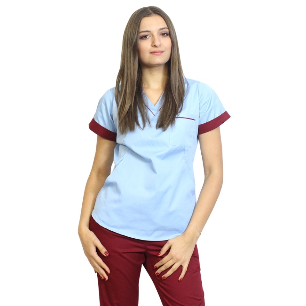 Medicinski kombinezon, sestavljen iz modre bluze z zrnatimi pasovi in modrih hlač, model Amani